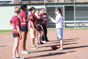 Mrs. Lindsay Atlas coaches up the girls during practice. Photo by Britney Donati. 