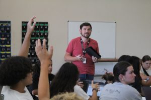 During Mr. Keagan Anzalone’s fourth period Integrated I class, students raise their hands to answer the question. Anzalone was hired for the 2024-25 school year to teach Integrated I and II. Photo by Riley Rust