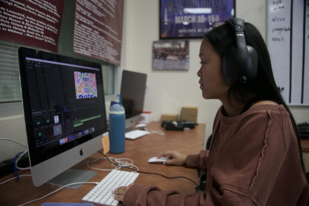 In the broadcasting room, Kaitlyn Leu edits recordings and timeline for an episode of her podcast, “Big Talks Tiny Host” Oct. 18. Photo by Natalie Deeble.